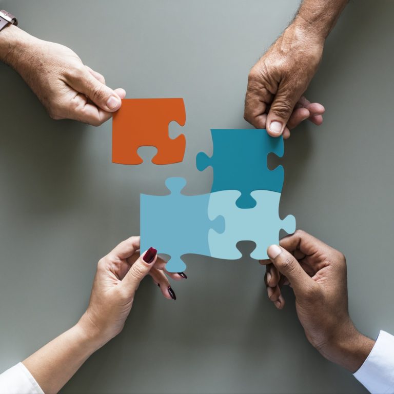 Business teamwork cooperation jigsaw isolated