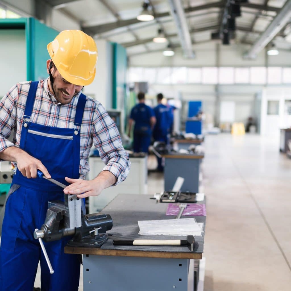 industrial factory employee working in metal manufacturing industry