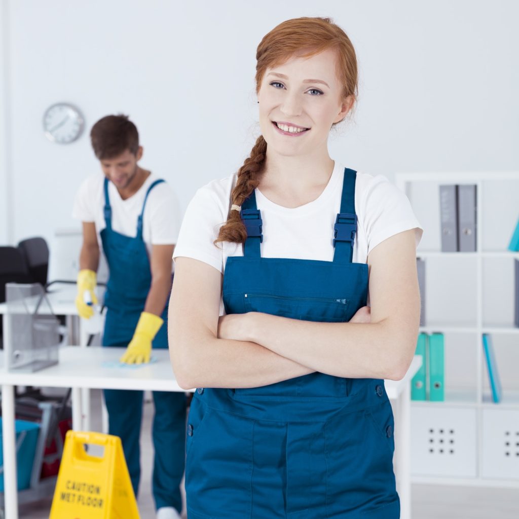 Smiling cleaner in office